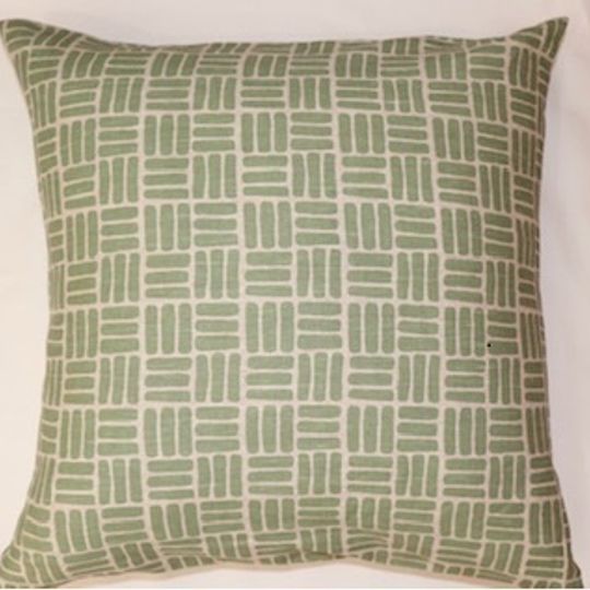 Sage green weave print cushion cover on linen background
